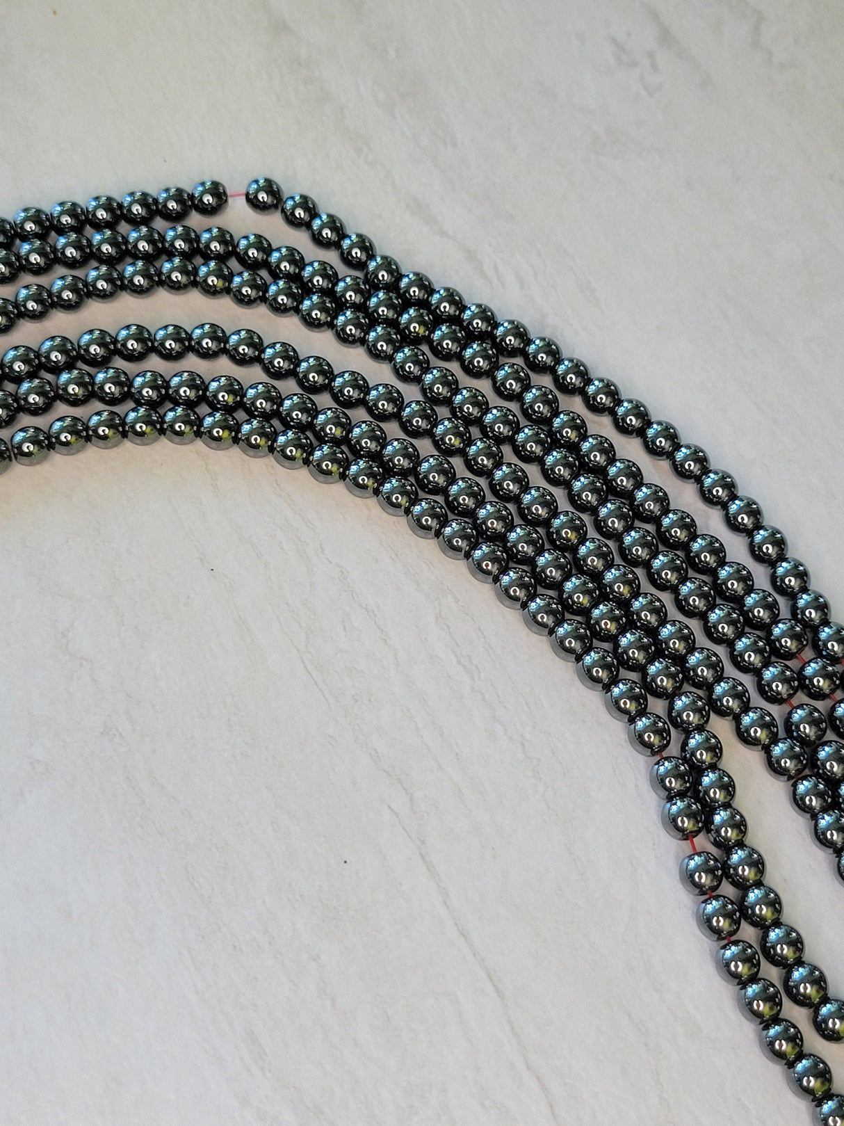 Non-magnetic synthetic hematite beads strands, aa grade round beads