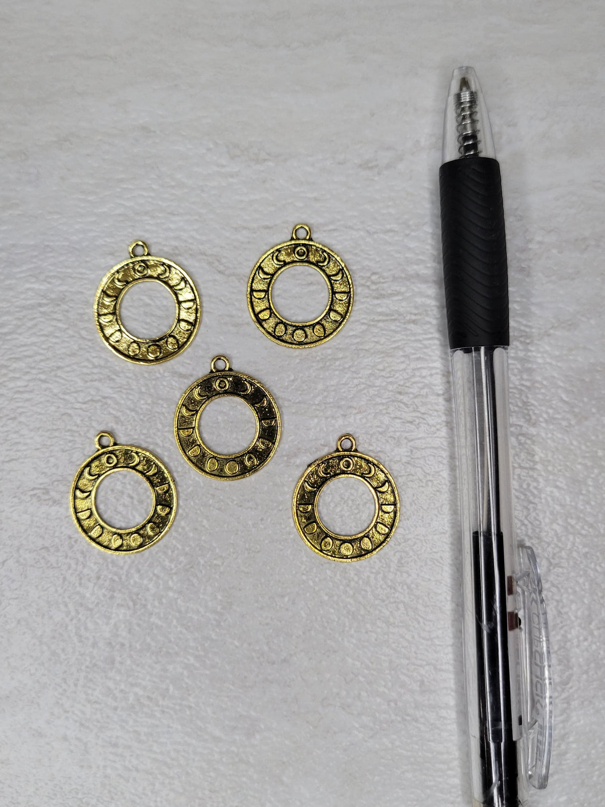 Round moon phase charm antique golden color