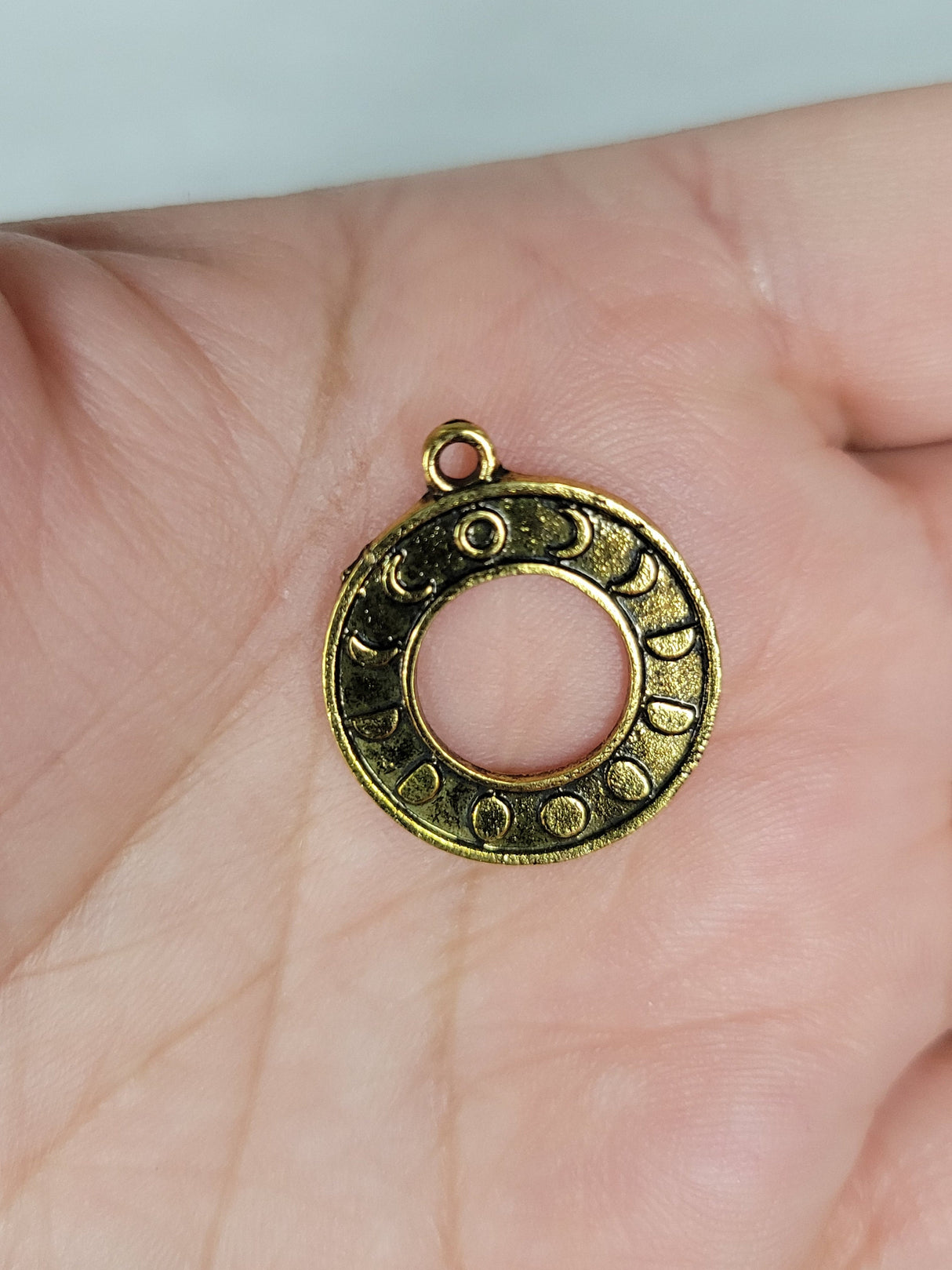 Round moon phase charm antique golden color