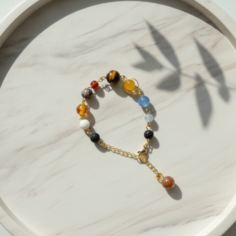 Bracelet with multicolored beads on a marble surface