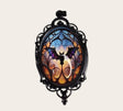 oval gothic bat pendant with a colorful glass cabochon in a black ornate frame