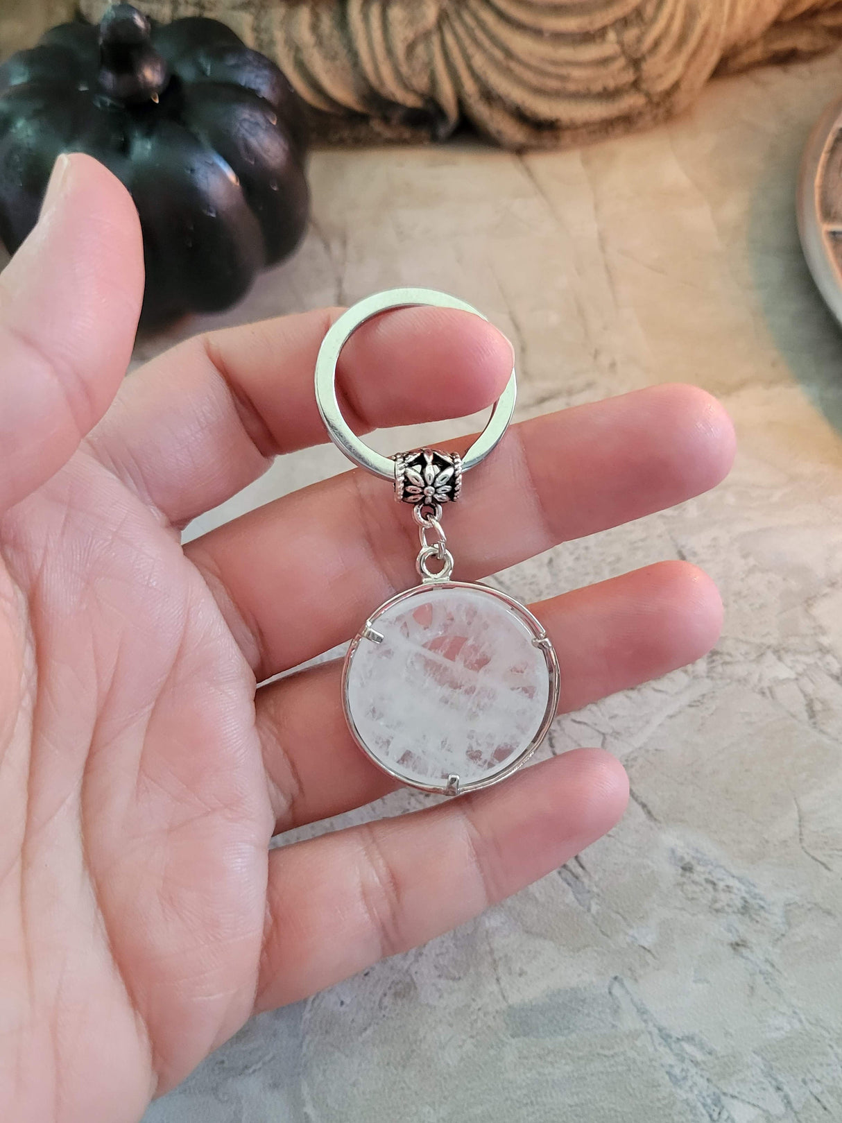 Natural quartz crystal keychain, flat round with sun & moon