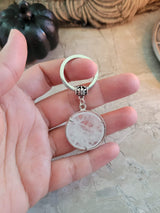 Natural quartz crystal keychain, flat round with sun & moon