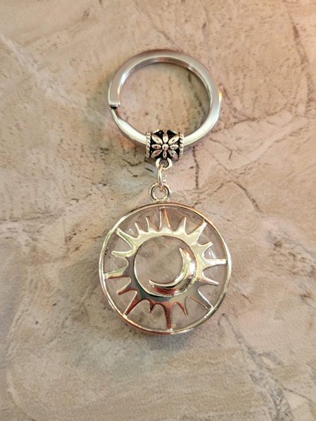 Natural quartz crystal keychain, flat round with sun & moon