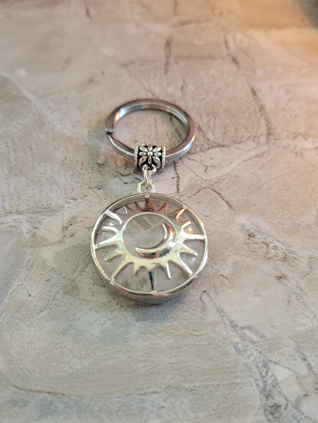 Natural quartz crystal keychain, flat round with sun & moon