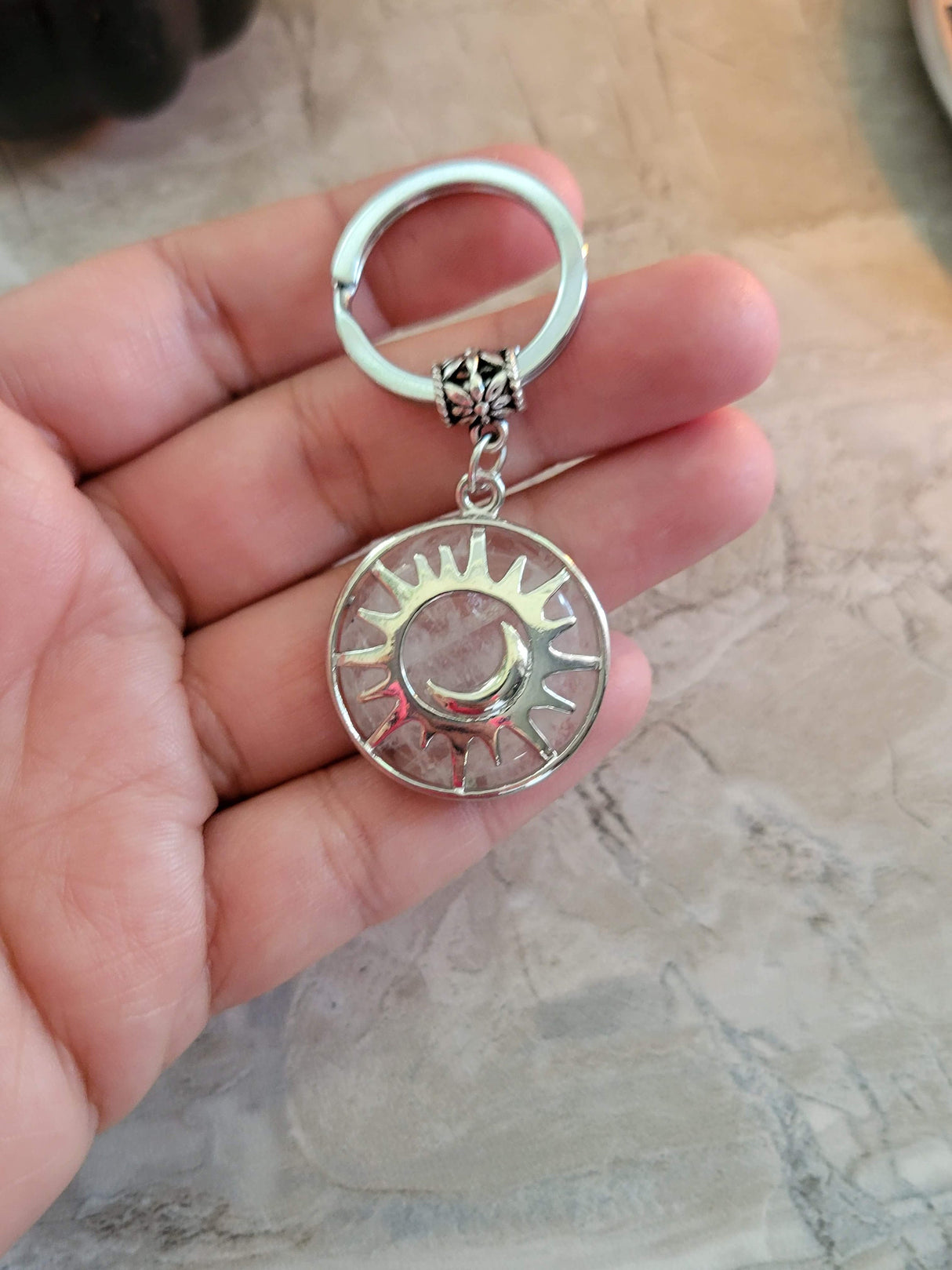 Natural quartz crystal keychain, flat round with sun & moon