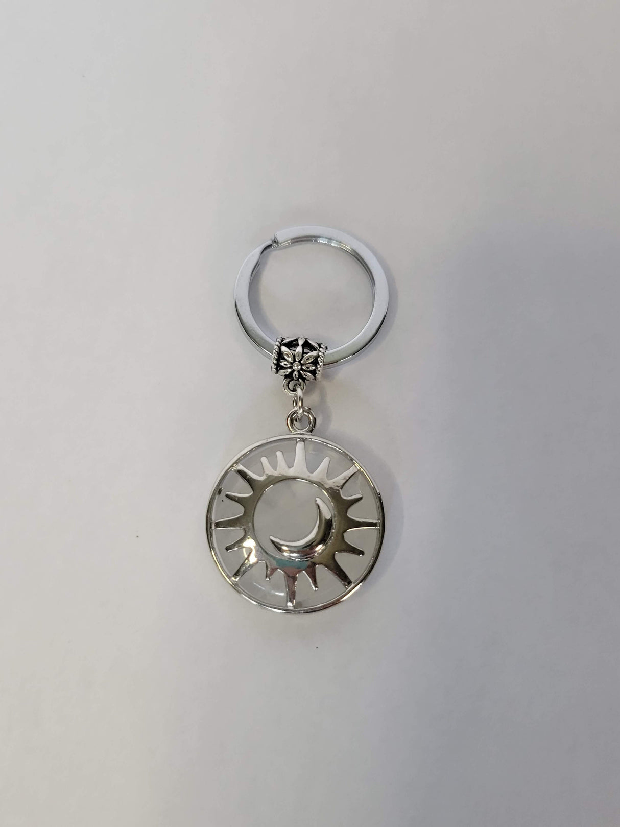 Natural quartz crystal keychain, flat round with sun & moon