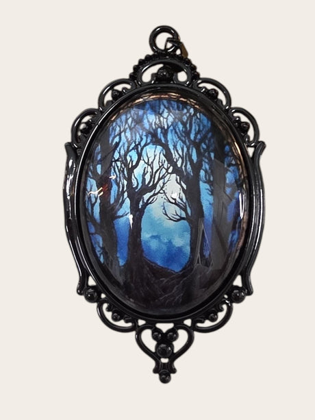 My Magic Place Shop oval pendant featuring a moonlit forest scene in a vintage-style black filigree metal setting.