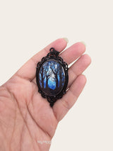My Magic Place Shop enchanted forest oval glass pendant with a black vintage-style filigree metal frame.