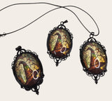My Magic Place Shop witch hat cameo pendant necklaces with stained-glass art in ornate black gothic filigree frames.