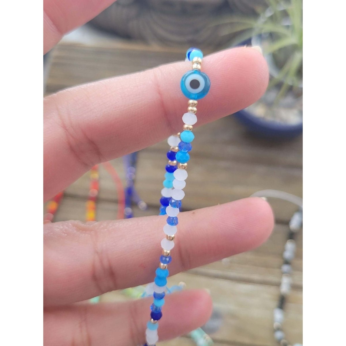 Pink coral shop bracelet evil eye